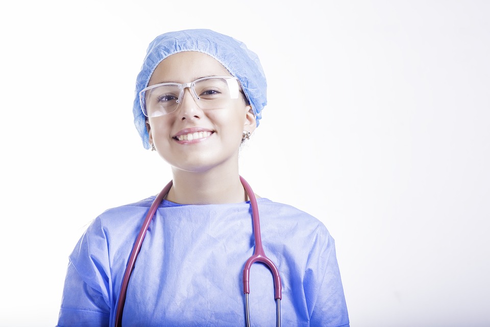 smiling young Latinx in scrubs