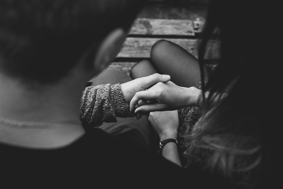 teen couple sitting together